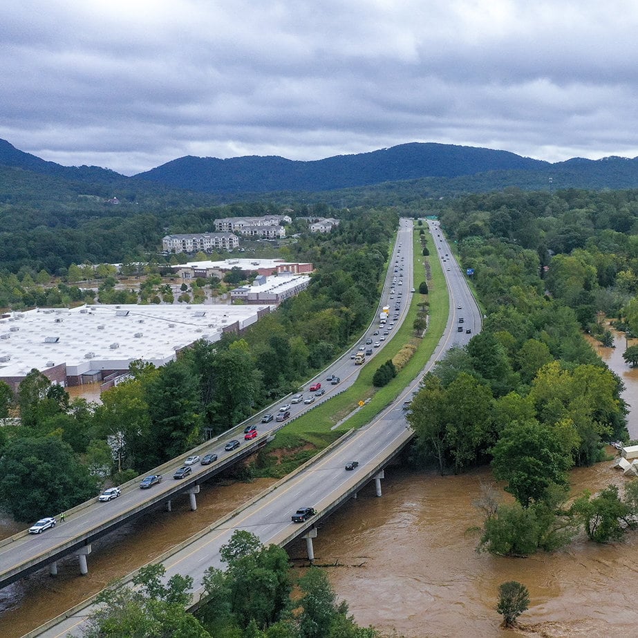 freeway over flooded brown river
