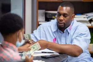Keynon Lake pays participant in tutoring program