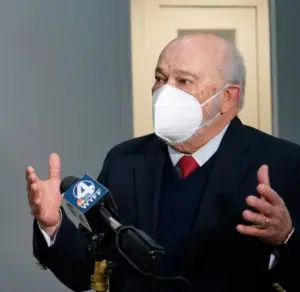 Sanesco CEO Hector Romero speaking into a microphone.