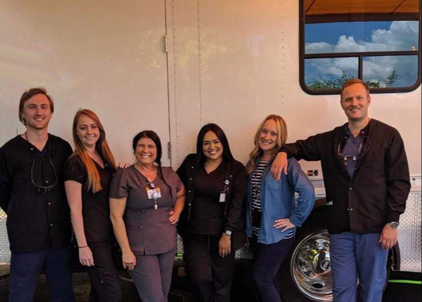 Blue Ridge Health team standing together in front of mobile clinic