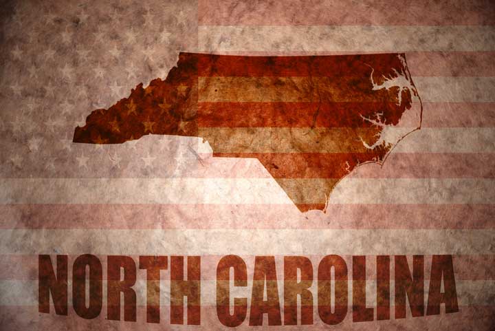 Silhouette of North Carolina over the American flag