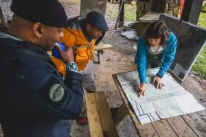 People looking over watershed map