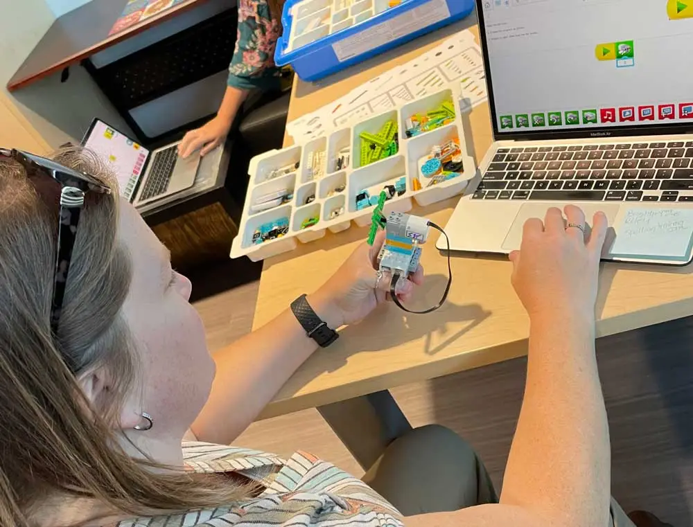 Teacher working with robot