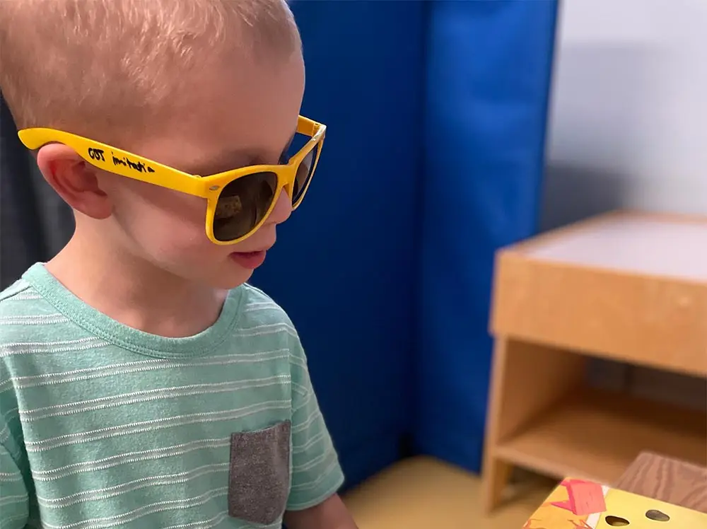 Boy with yellow sunglasses