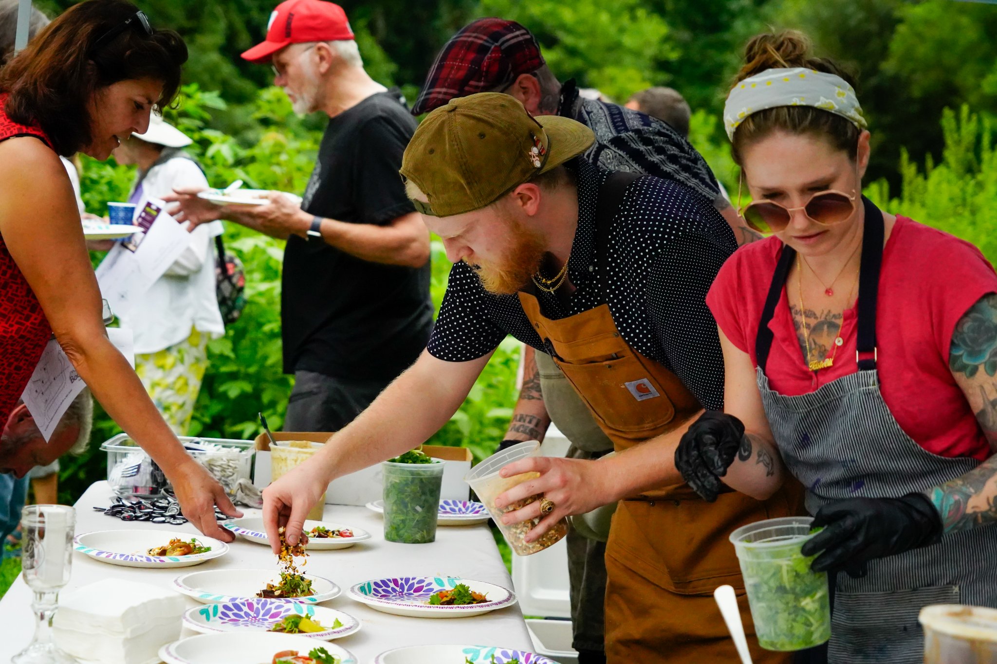 Volunteers plating food at an event