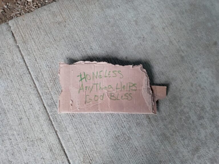 cardboard sign made by a homeless person