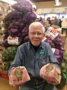 Man holding groceries in a store
