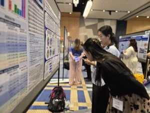 students observing displayed research at the University of Kentucky College of Public Health’s third annual showcase