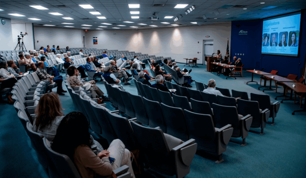 Dogwood Health Trust General Counsel Rachel Ryan speaks during a community meeting with Dogwood Healh Trust and Affiliated Monitors inside Ferguson Auditorium at Asheville-Buncome Technical Community College