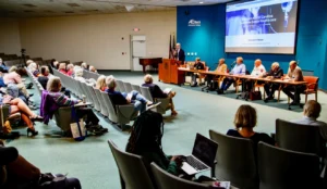 Dr. Bruce Kelly speaks during a "community shareholder meeting" April 24, 2025, at Ferguson Auditorium on the campus of AB Tech regarding the current conditions at Mission Hospital and the sale of Mission to HCA
