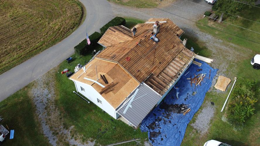 An aerial view of a house badly damaged by Hurricane Helene.