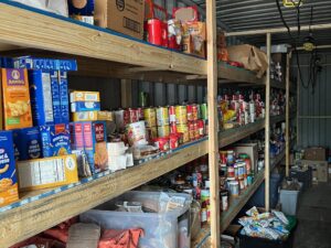 Shelves filled with donated food.