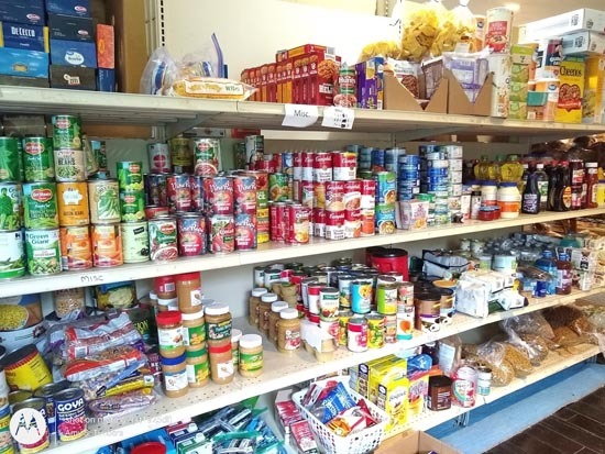 Shelves filled with donated food.