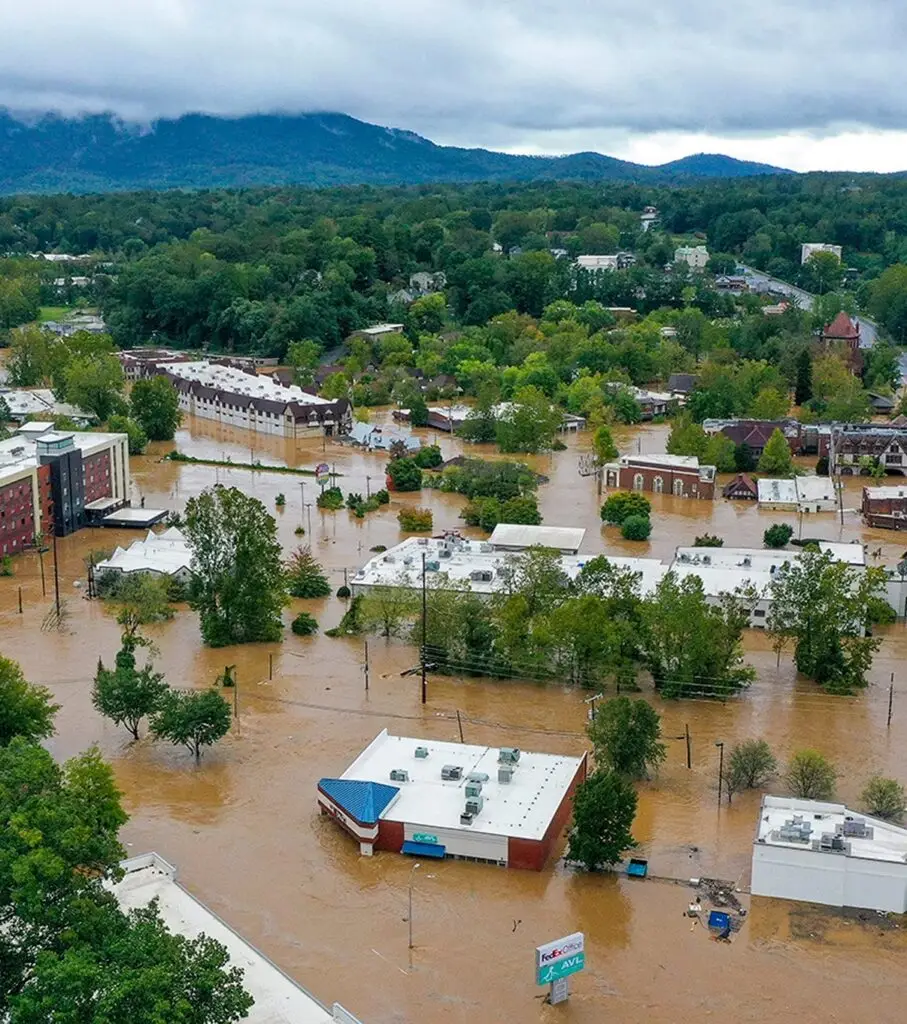 Aerial view of a town affected by flooding from Hurricane Helene and cover streets and surround buildings