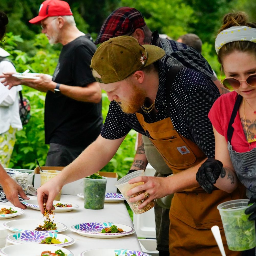 Volunteers plating food at an event