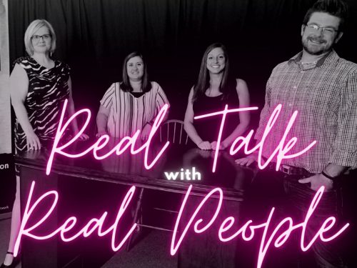 Burke Recovery Staff standing in front of desk with pink text reading "Real Talk with Real People"
