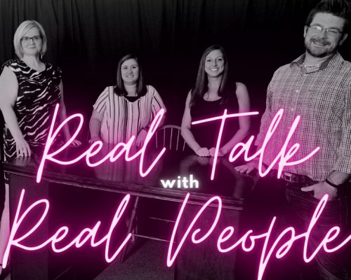 Burke Recovery Staff standing in front of desk with pink text reading "Real Talk with Real People"