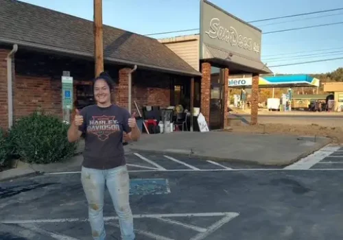 Jillian Tenge, owner of Jillian's Cafe (SanDee’s Cafe), dirty from Hurricane Helene clean up outside of her restaurant