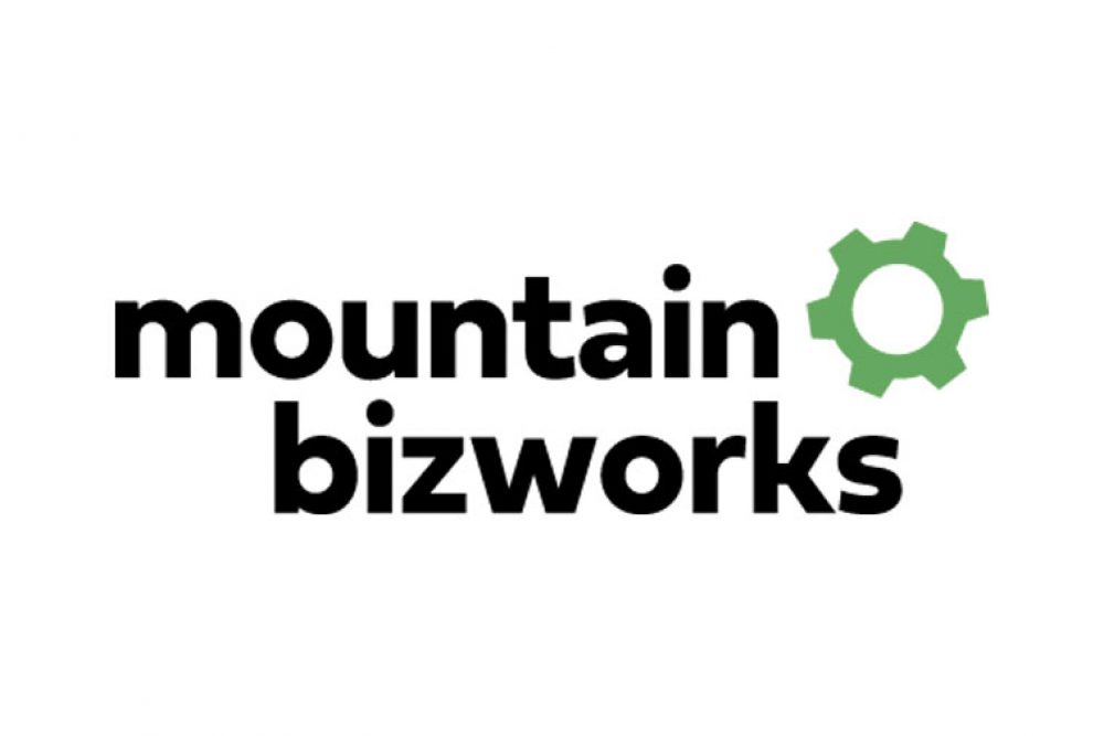 mountain bizworks logo with green cog wheel
