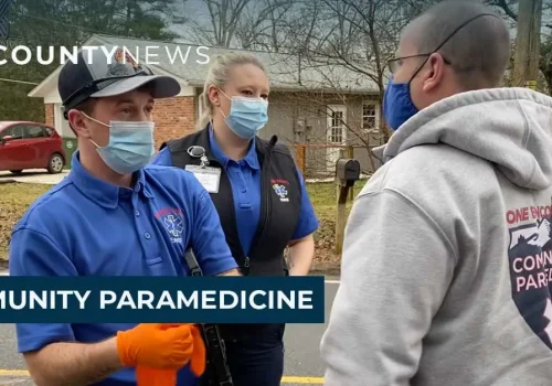 Paramedics talking to a man